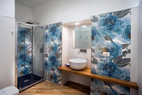 a bathroom with a sink and a shower at Il Centenario in Ascea