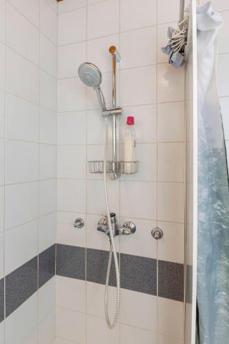 a shower with a shower head in a bathroom at Apartma Alpine Space, Kranjska Gora - Center in Kranjska Gora