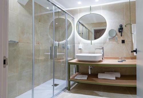 a bathroom with a sink and a shower at DWO Valencia in Valencia