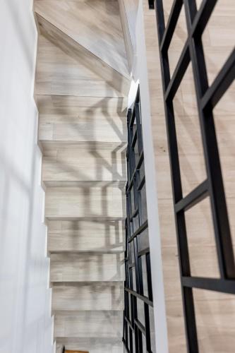 a shadow on the wall of a building at Pagani Green - Luxury Maisonette B3 in Kalamata