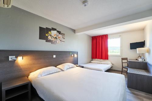 a hotel room with a large bed and a window at Authentic by balladins Dijon / Marsannay-la-Côte in Marsannay-la-Côte
