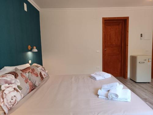 a bedroom with a bed with towels on it at La Casa Di Lucia in San Vito Chietino