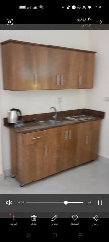 a kitchen with a counter top with a sink at ميراج باى in Safaga