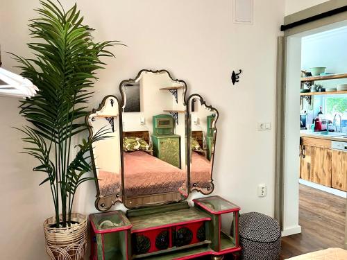 a mirror on a dresser in a room at Bohemian Eco lodge át lake Balaton in Kisapáti