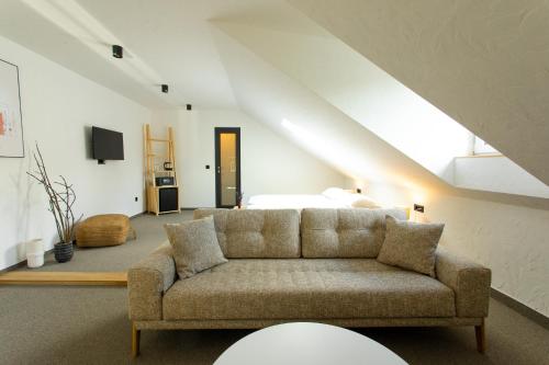 a living room with a couch and a bed at VILLA BASAMAK in Sarajevo