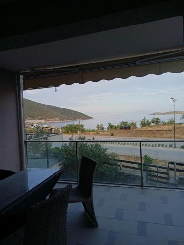 a view of the ocean from a room with a window at Peramos View Luxury Maisonette in Nea Peramos