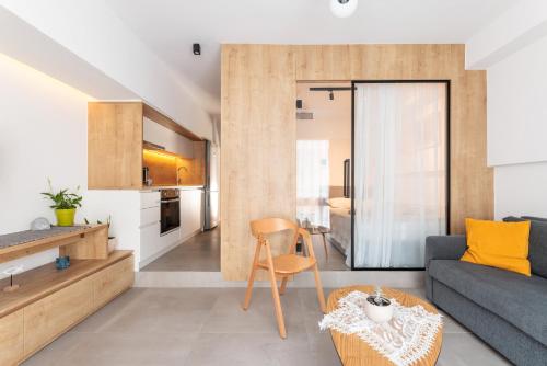 a living room with a couch and a table at SKG Urban Boutique in Thessaloniki