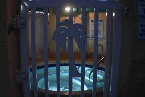 a crib in a room with a pool of water at Pelican's Roost, Waterfront comfort at Venture Out in Cudjoe Key