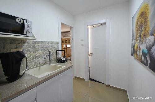 Cuina o zona de cuina de אוטופיה בצפון - מתחם אירוח מפואר