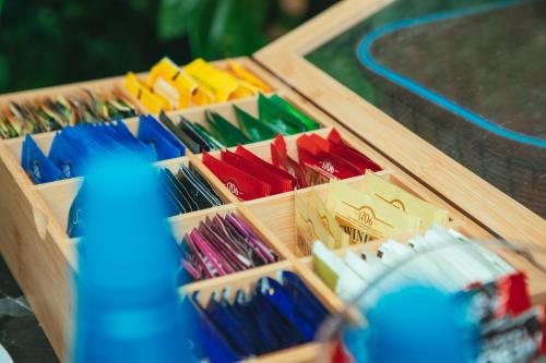 a wooden box filled with different colored umbrellas at Hotel Marcos Gamero in Talca