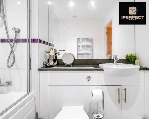 a bathroom with a toilet and a sink and a shower at Cosmo Modern Apartment Central By Your Perfect Stay Short lets Birmingham in Birmingham