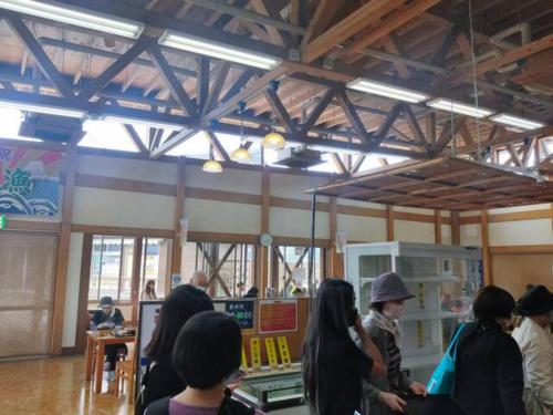 a group of people standing around in a store at FUKUOKA FUKUTSU MUNAKATA YUSUKE HOUSE in Kōnominato