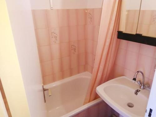 a bathroom with a shower and a sink and a tub at STUDIO Climatisé proche plage 4 PERS in Cavalaire-sur-Mer