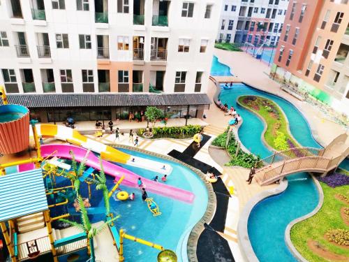 an aerial view of a water park at a resort at Transpark Juanda by 21 Room in Bekasi