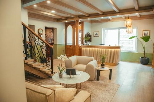 a living room with a couch and a table at Hotel Marcos Gamero in Talca