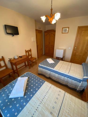 Postel nebo postele na pokoji v ubytování Hostal Jose Mari