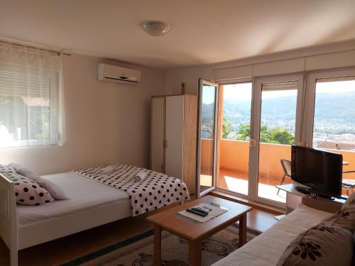 Ένα ή περισσότερα κρεβάτια σε δωμάτιο στο MD Apartments