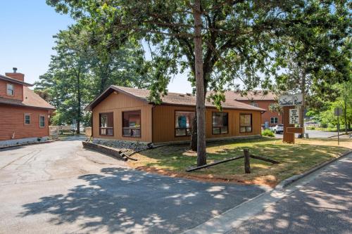 a small building with a tree in front of it at Thunderbird Resort Condo in Wisconsin Dells