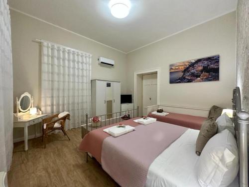 Postel nebo postele na pokoji v ubytování Home Pompei Olympus