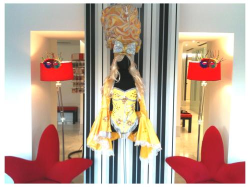 a dress on a mannequin in front of a mirror at Hotel Sitges in Sitges