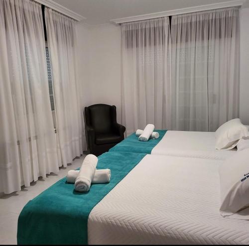 Ένα ή περισσότερα κρεβάτια σε δωμάτιο στο Casa Mariano
