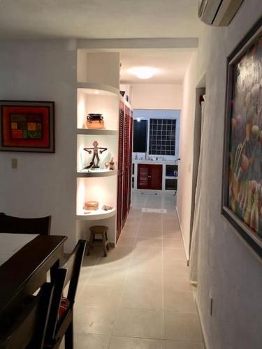 a hallway of a house with a dining room at Casita Sac-Nicté in Mahahual