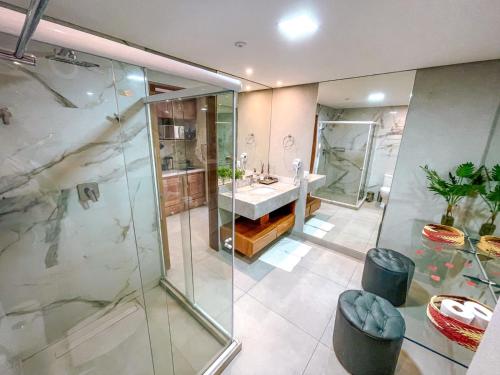 a bathroom with a shower and a sink at Flat Completo Pipa no condominio do lle de Pipa in Pipa