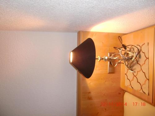 a lamp on the corner of a room at Apart Sissy in See