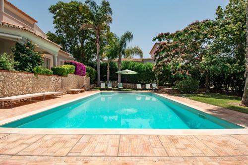 a swimming pool in the backyard of a house at Casa La Vendola in Estômbar