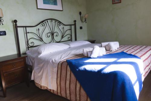 Postel nebo postele na pokoji v ubytování Borgo Giusto Tuscany