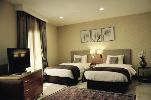 Cama o camas de una habitación en Asherij Hotel