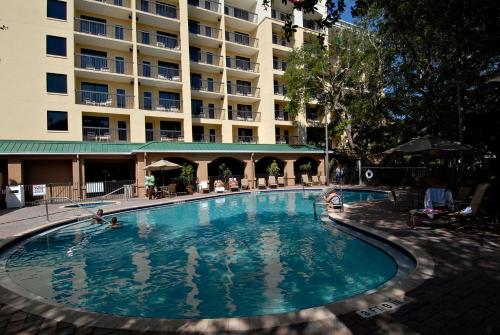 a large swimming pool in front of a hotel at Courtyard by Marriott Cocoa Beach Cape Canaveral in Cocoa Beach