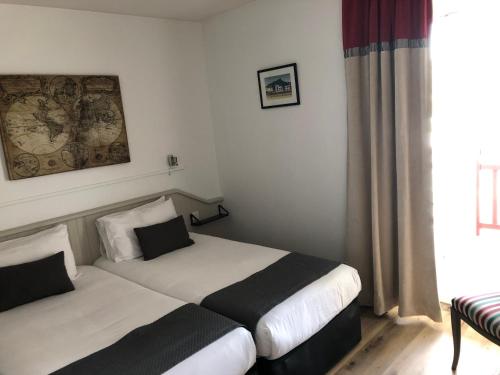 Hôtel Ursulaにあるベッド