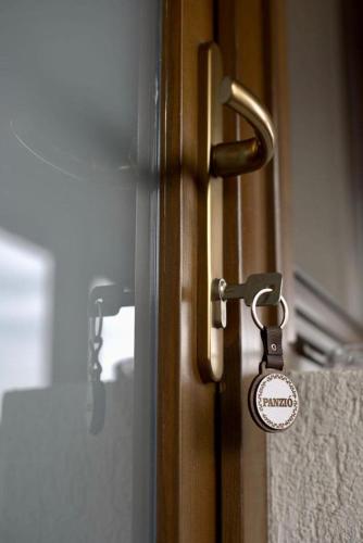 a door with a lock on a glass door at Bingyó Vendégház in Lupeni