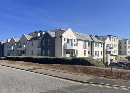 a row of houses on the side of a street at Pentire Headland Retreat in Newquay