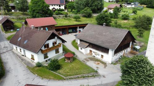an aerial view of a house with two roofs at Ferienwohnung Biohof Untermar in Obervellach