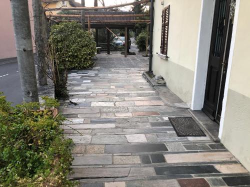 a stone walkway next to a building at Pensione Solaria in Locarno