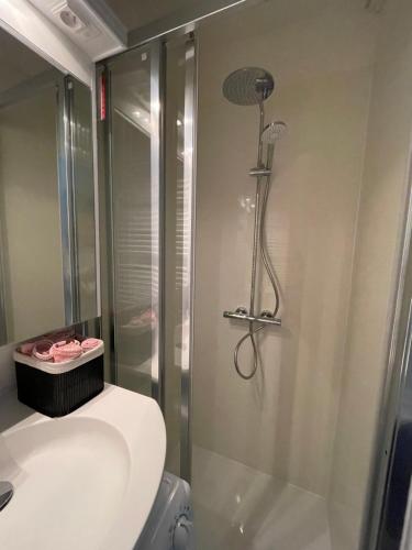 a bathroom with a shower and a toilet at Studio Suite Lido in Koksijde