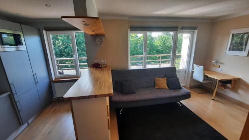 a living room with a couch and a table at Apartment Kauguri in Jūrmala