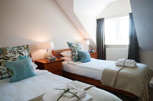 Postel nebo postele na pokoji v ubytování Hillside Lodge B&B