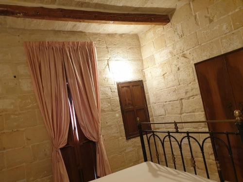 Ein Bett oder Betten in einem Zimmer der Unterkunft Tifkira (The Memory)