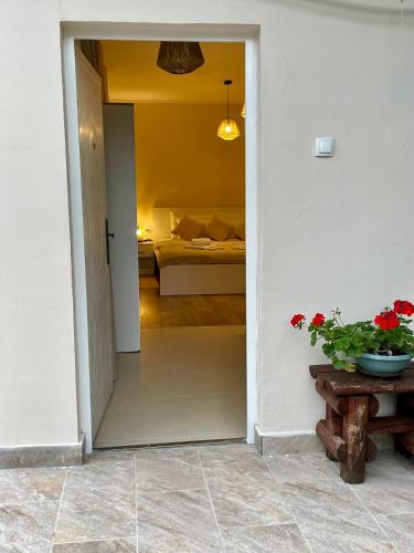 a door leading into a room with a bedroom at Airport Apartments Alexandra in Surčin