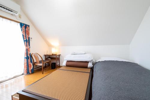 Llit o llits en una habitació de Hiei Blue Roof - Vacation STAY 13887