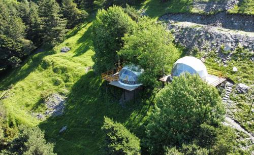 an aerial view of a yurt and a house at Elia Glamping in Stepantsminda