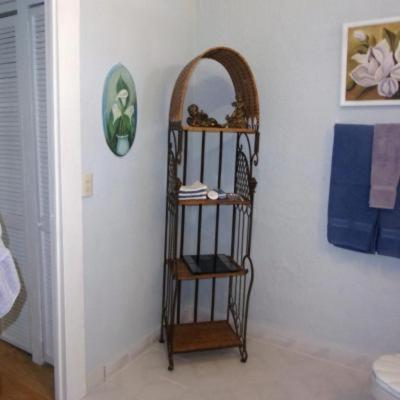 a shelf in the corner of a room at Casita Montana Hotel in Ajijic
