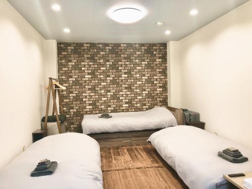 Llit o llits en una habitació de Polar Resort KAWAGUCHI URBAN - Vacation STAY 29860v