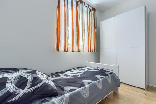 Ένα ή περισσότερα κρεβάτια σε δωμάτιο στο Apartmani Rialto
