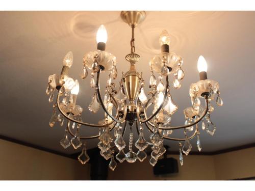 a chandelier hanging from a ceiling at Gusthof Lumiere - Vacation STAY 41339v in Fujikawaguchiko