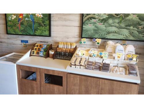 a store counter with food and other items on it at La'gent Hotel Okinawa Chatan Hotel and Hostel - Vacation STAY 59128v in Fuenzan