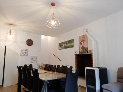 a dining room with a table and chairs at La Dimora di Pietra in Gubbio